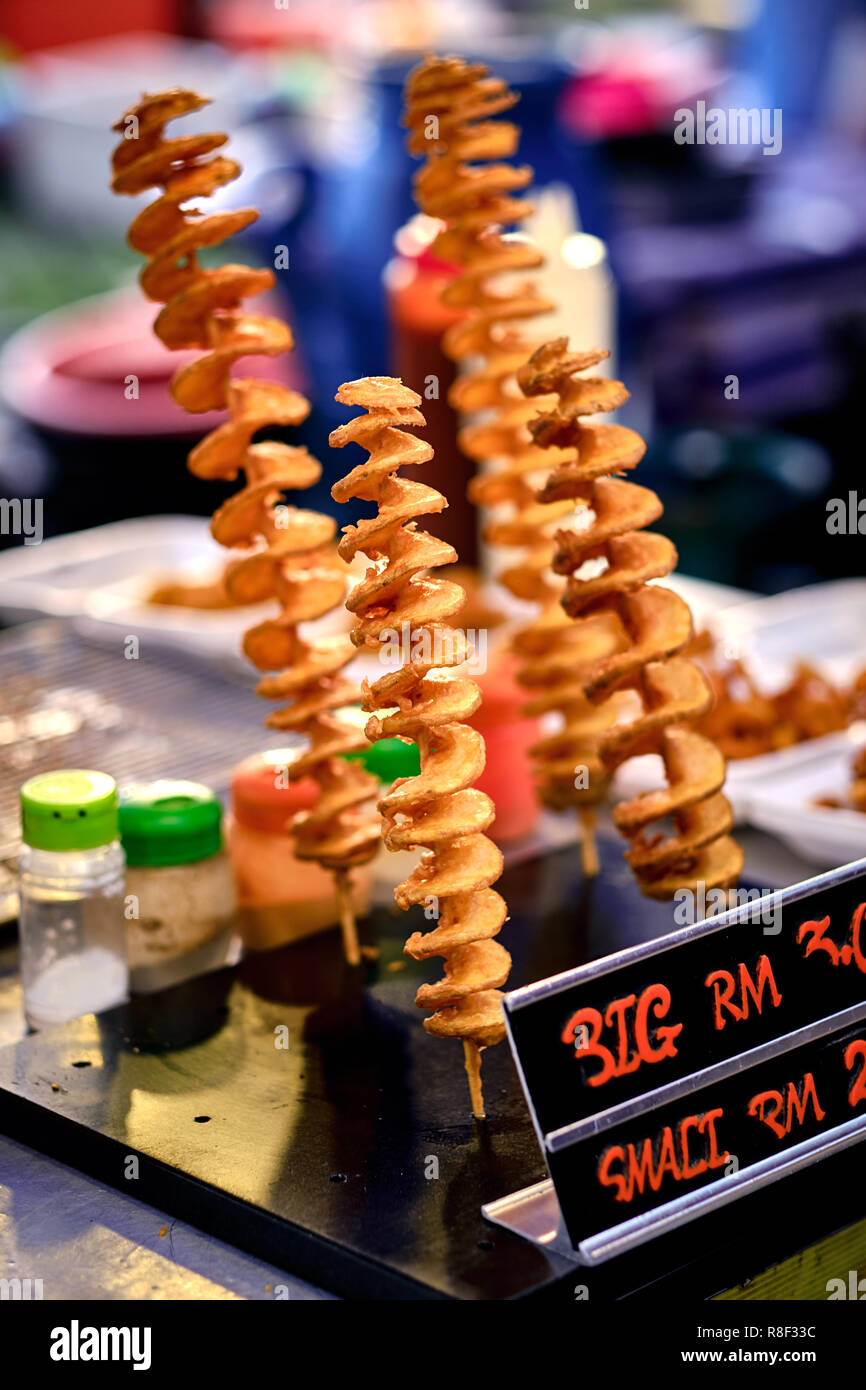 Fried twisted potato traditional asian street food. Asian, Indian and
