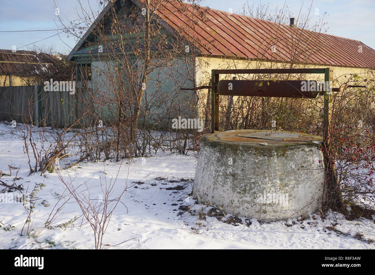 Old abandoned well in russian village Stock Photo