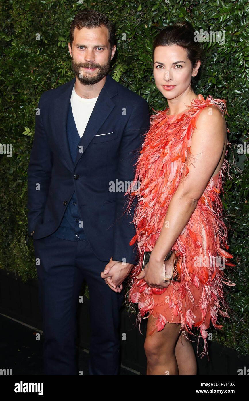BEVERLY HILLS, LOS ANGELES, CA, USA - MARCH 03: Jamie Dornan, Amelia Warner  at the Chanel And Charles Finch Pre-Oscar Awards Dinner 2018 held at Madeo  Restaurant on March 3, 2018 in
