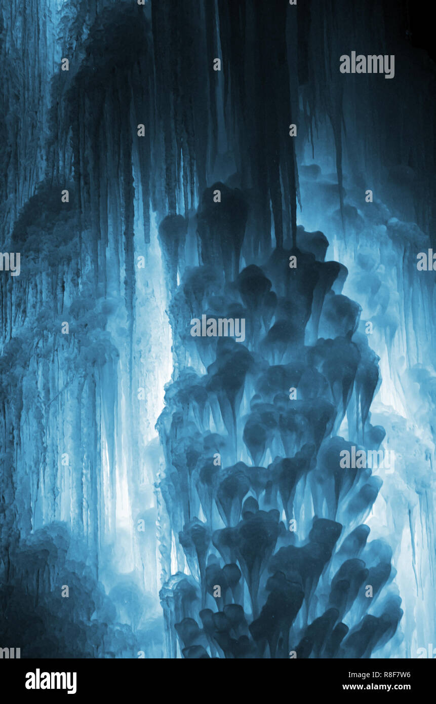 Huge ice icicles. Large blocks of ice frozen waterfall or water. Blue ...