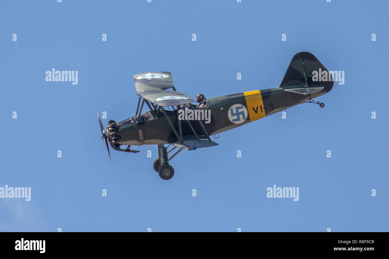 VL Viima vintage 1939 biplane two-seat trainer of the Finnish Air Force performing aerobatics at the FAF 100 Years Anniversary Air Show. Stock Photo