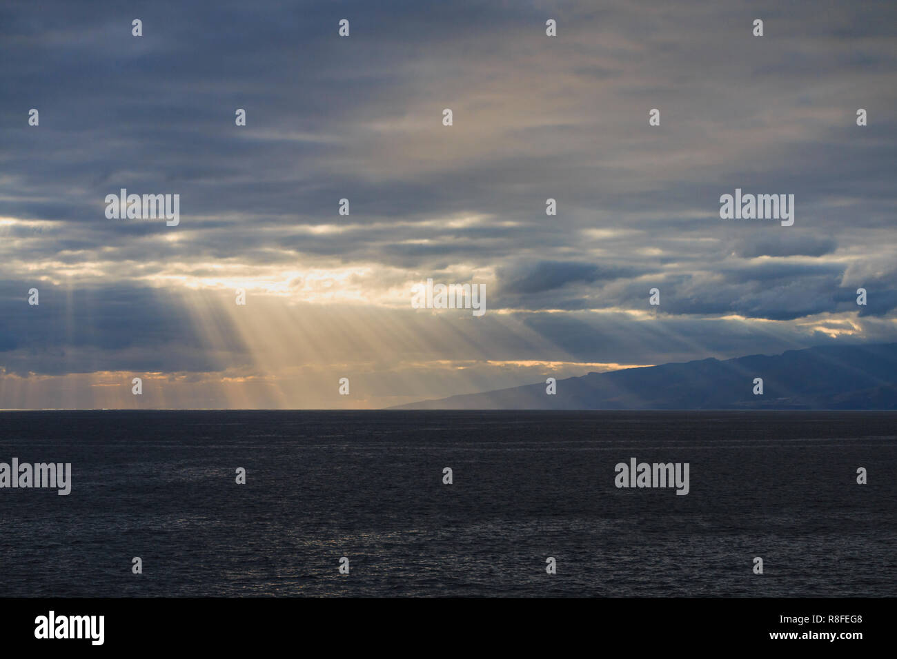 Sun rays are shining through the clouds Stock Photo