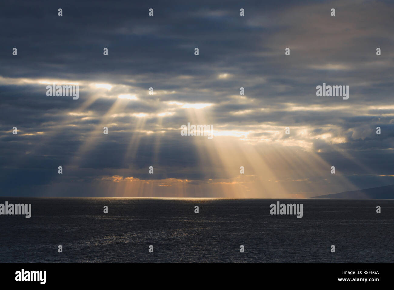 Sun rays are shining through the clouds Stock Photo