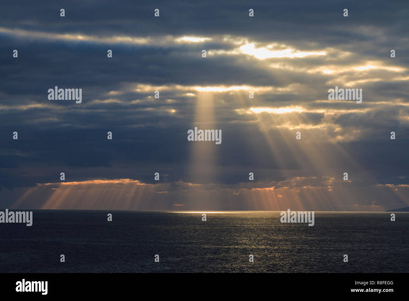 Sun rays are shining through the clouds Stock Photo