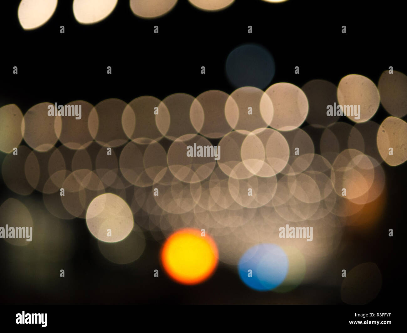 Defocused christmas lights, bokeh background with yellow and blue lights Stock Photo