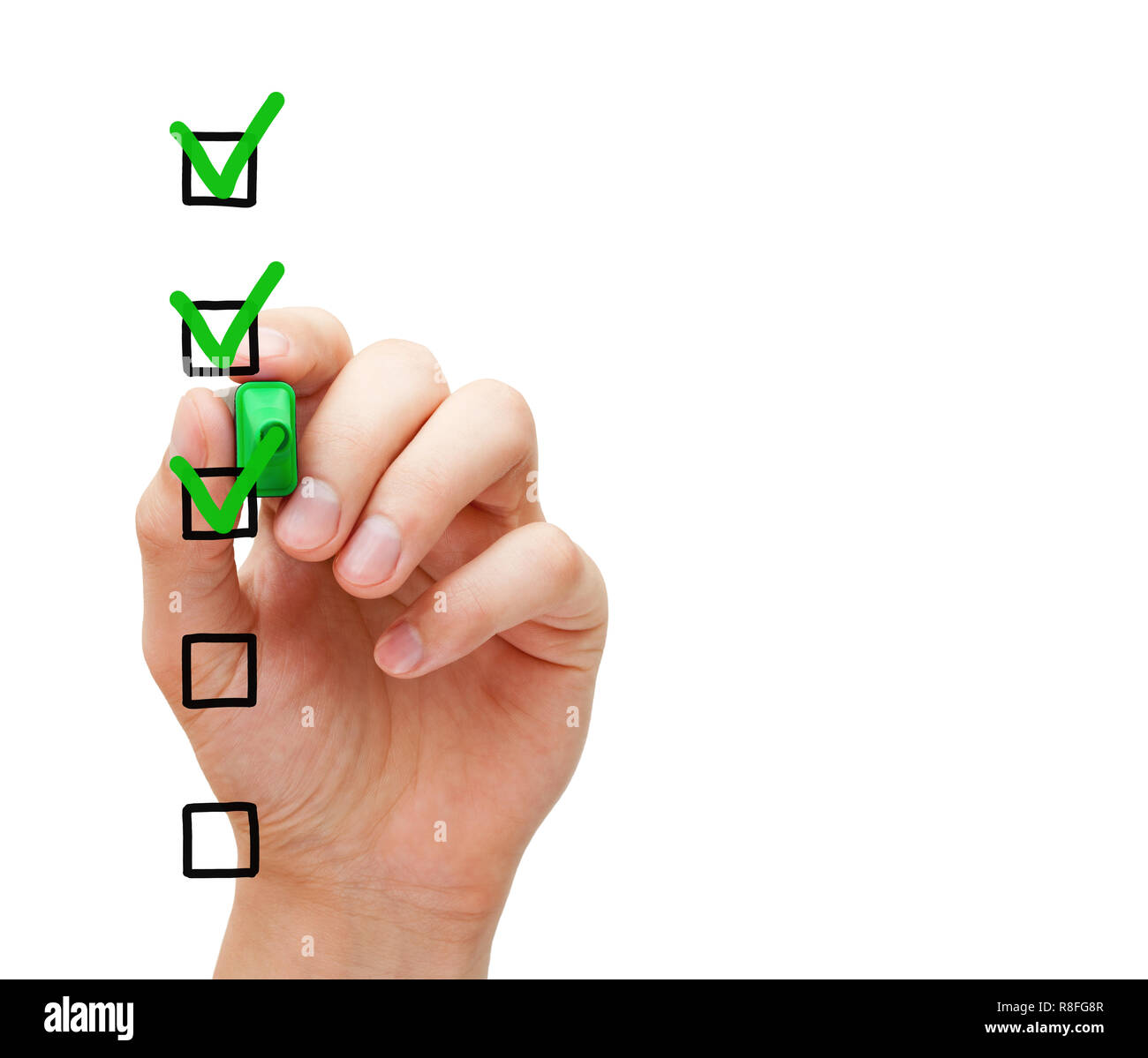 Hand putting three check marks with green marker on blank customer survey checklist on transparent glass board. Stock Photo