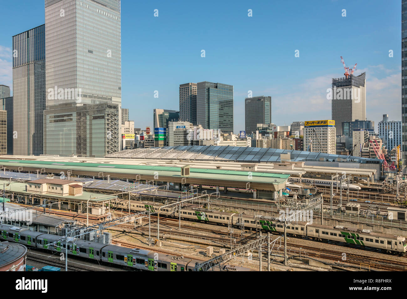 View over the Shinkansen hub at Tokyo Central Station and the Marunouchi skyline, Tokyo, Japan Stock Photo