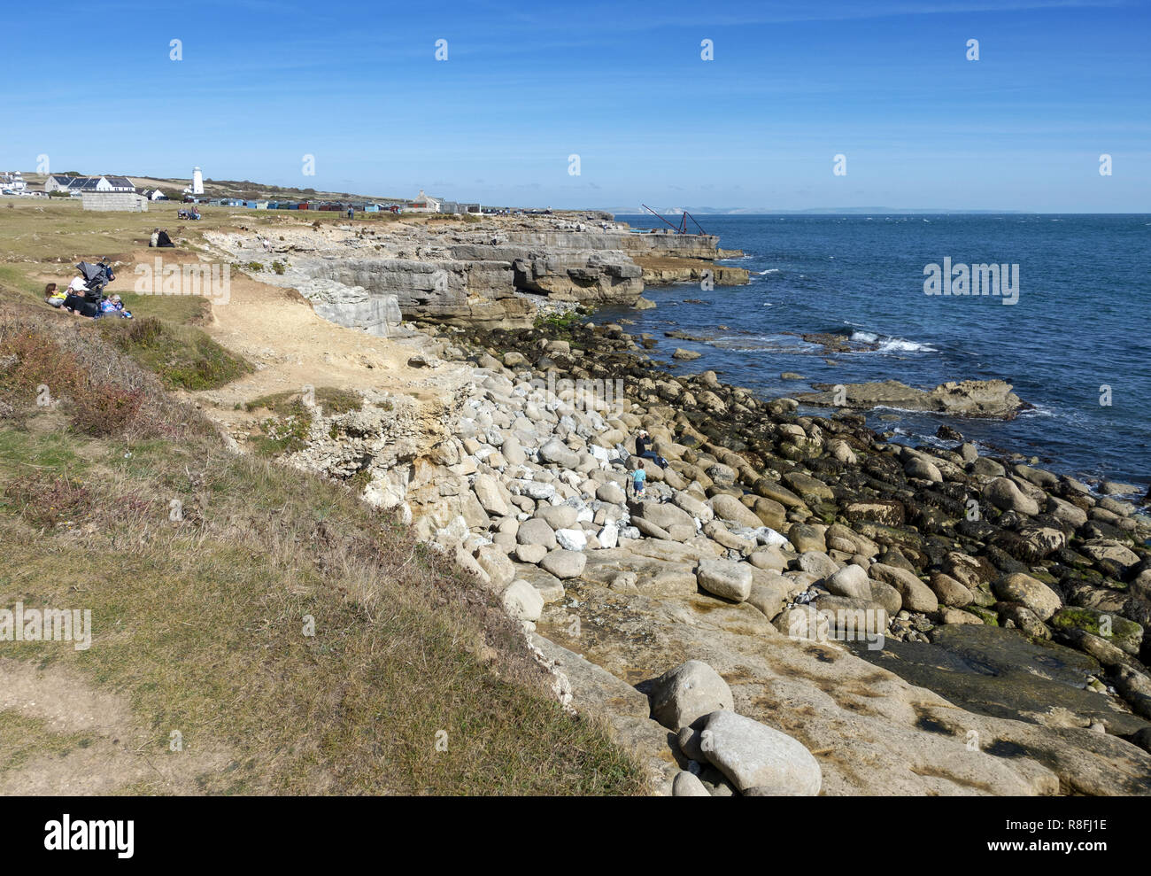 View of the coastline and small fishing huts on the Isle of Portland, Weymouth, Dorset, England, UK Stock Photo