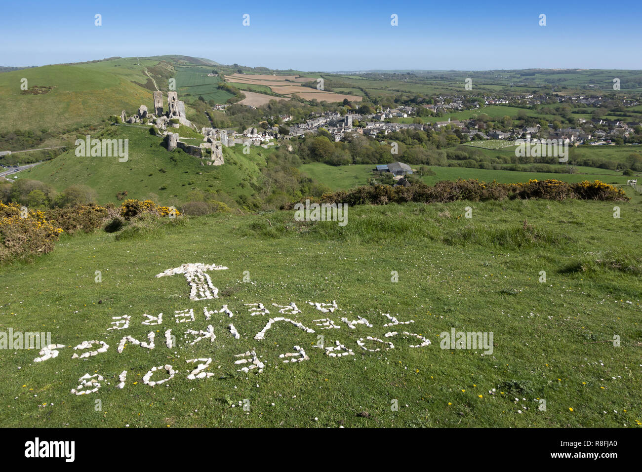 Corfe Castle and village on the Isle of Purbeck, Dorset, England, UK Stock Photo