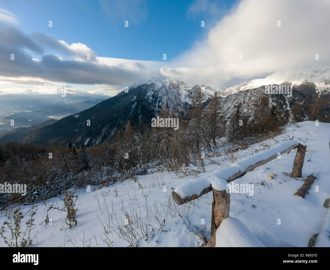 Winter landscape with first snow freshly fallen just covering the scene. Roblek at Begunjscica, Slovenia. Stock Photo