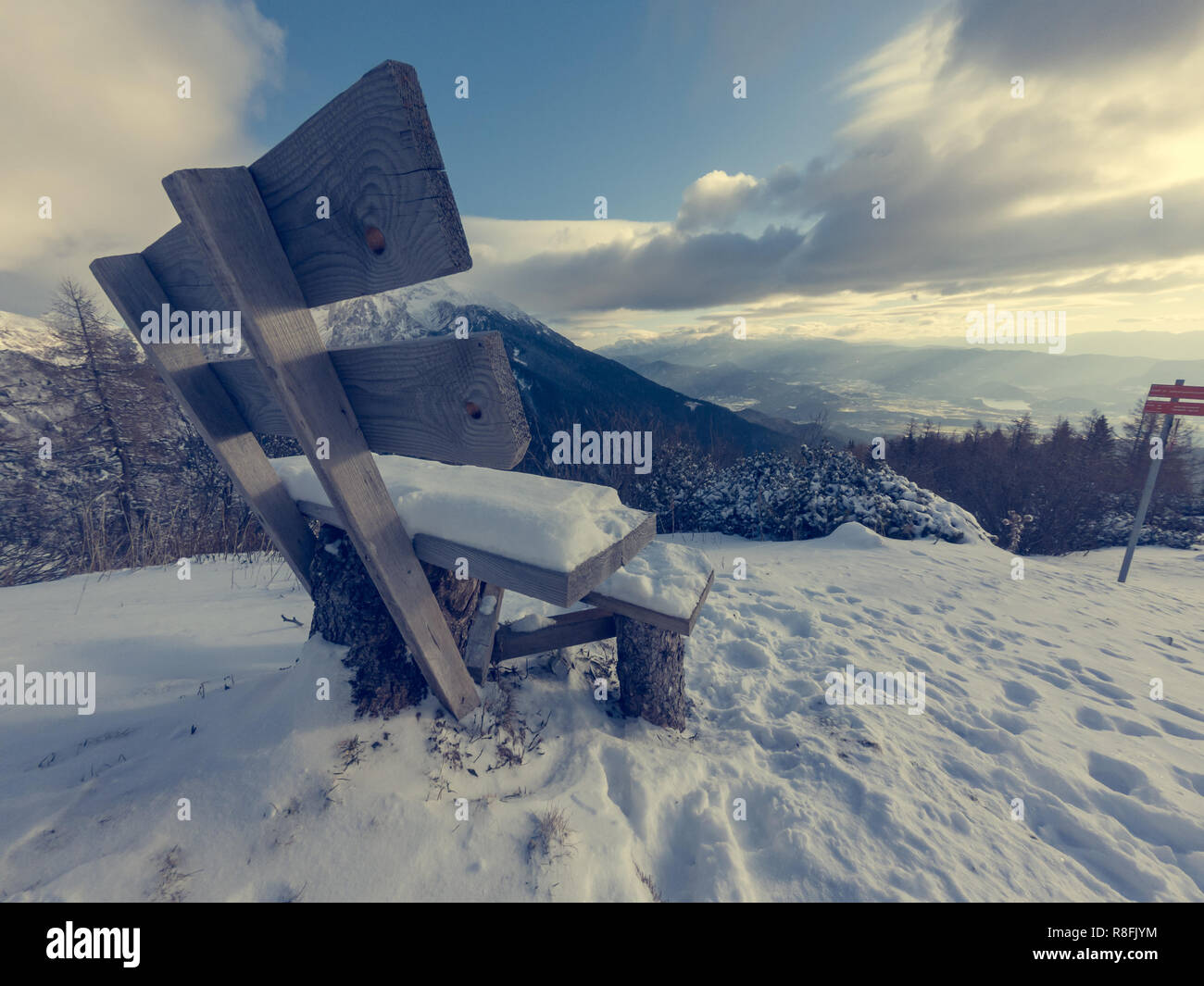 Winter landscape with first snow freshly fallen just covering the scene. Roblek at Begunjscica, Slovenia. Stock Photo