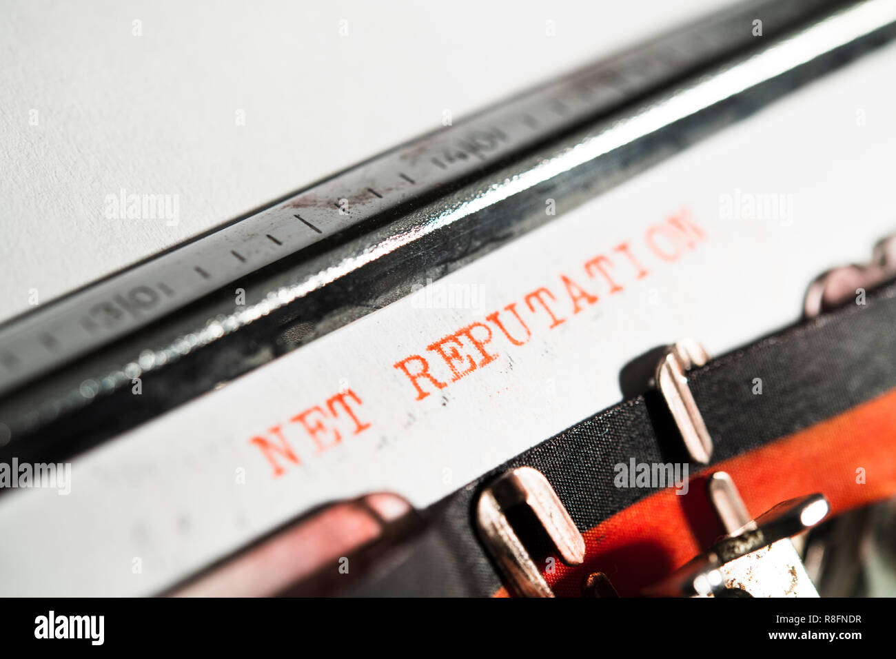 'Net reputation' red text on white paper in vintage typewriter detail, reputation and reliability concept Stock Photo