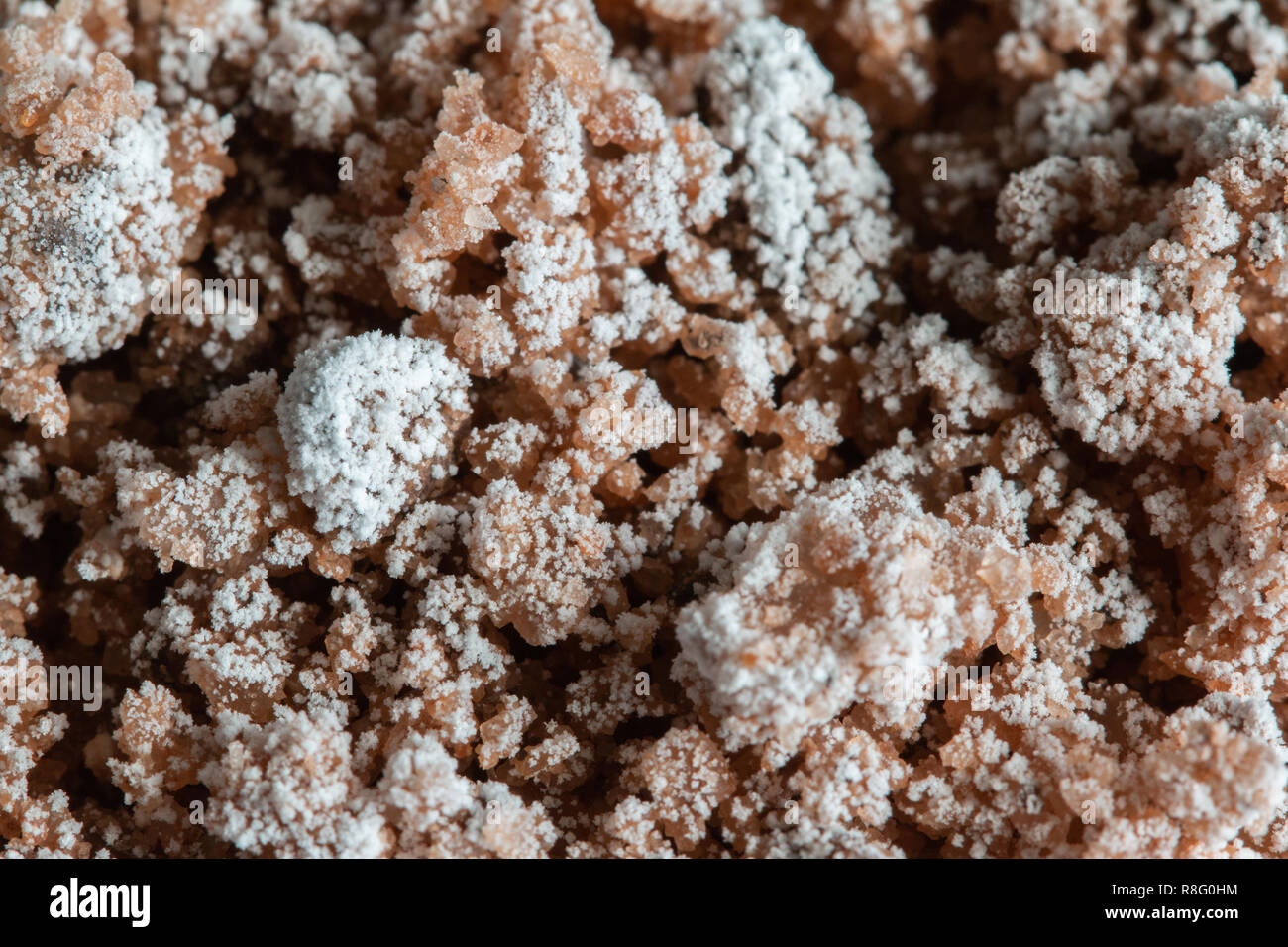 Close up of rock salt with a white salty layer on top Stock Photo