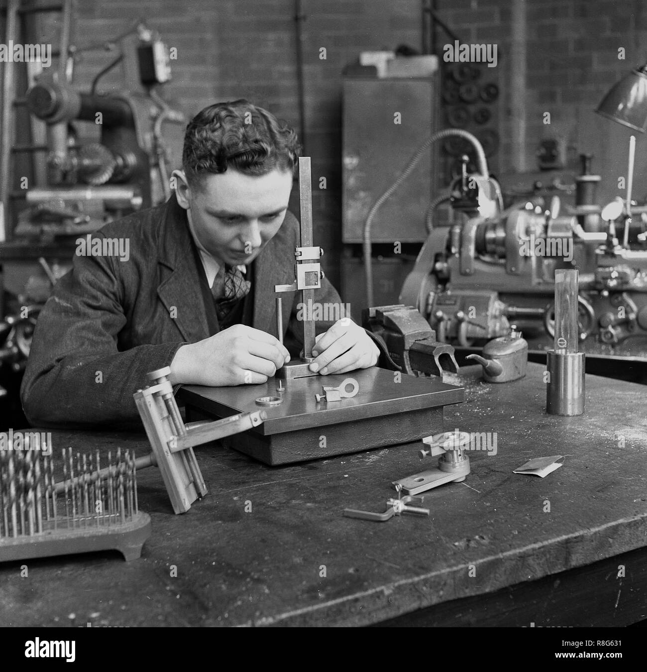 1948, historical, Leeds University, a male engineering student in a workshop using measuring equipment to make machine tools, England, UK. Stock Photo