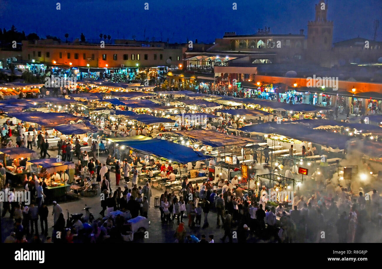 STREET MARKET, JEMAA-EL FNAS, MARRAKECH, MOROCCO. MAY 2011. Medina Old City in the centre of Marrakech in Morocco on an early evening with crowds gath Stock Photo
