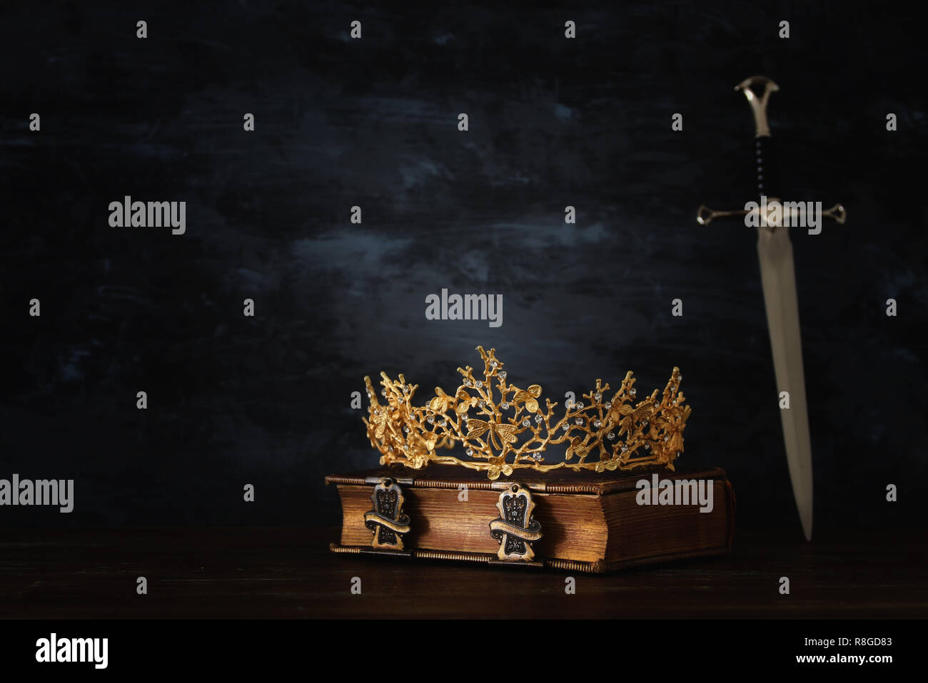 low key image of beautiful queen/king crown and sword. fantasy medieval ...
