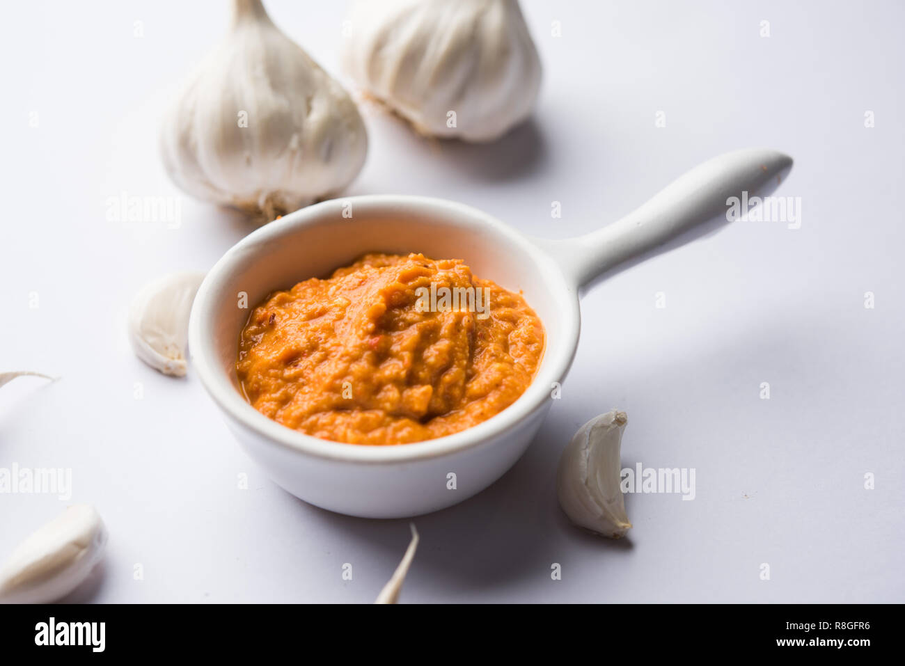 Garlic chutney, made using lahsun/lehsun originating from the India, served in a bowl over moody background. selective focus Stock Photo
