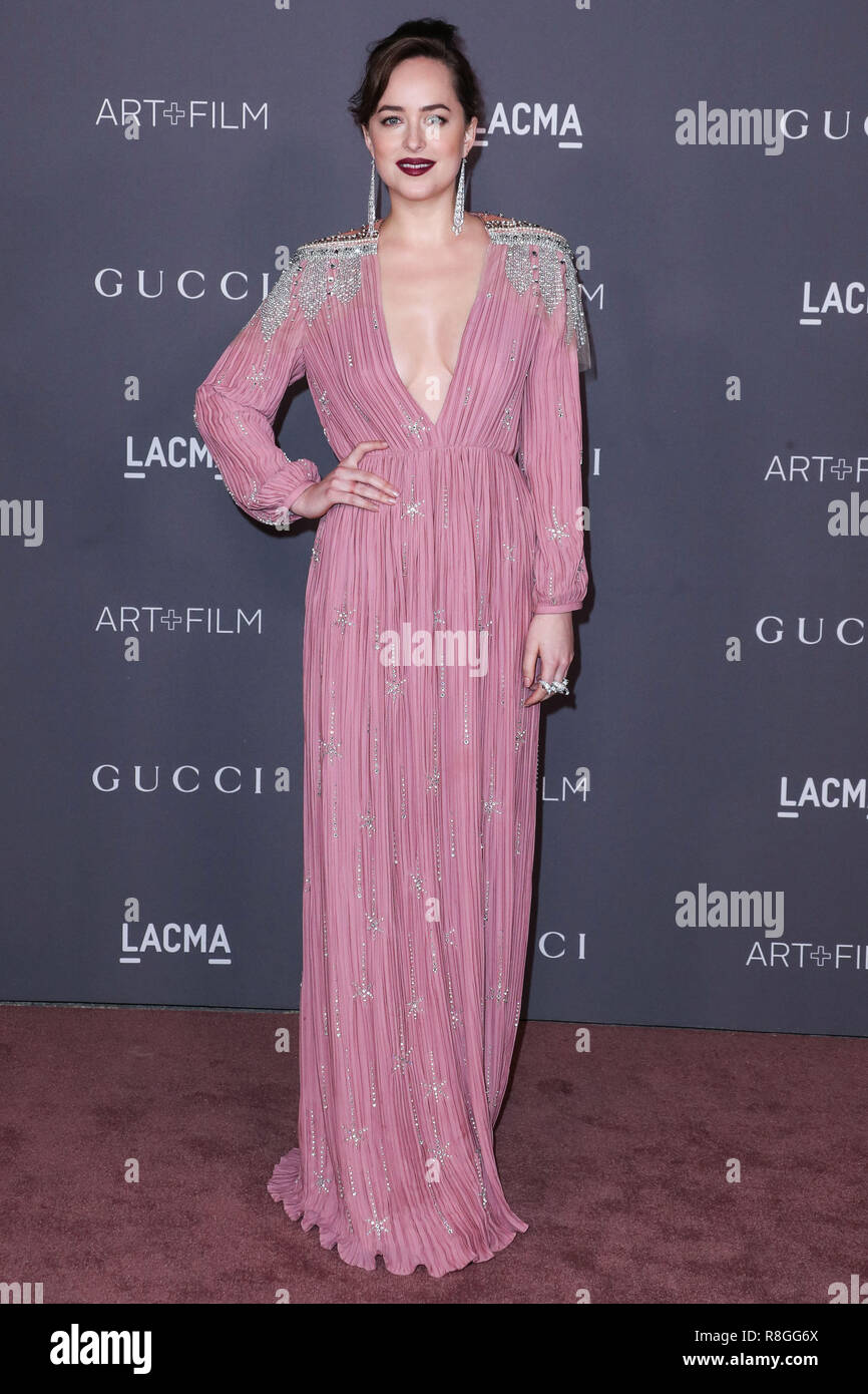 LOS ANGELES, CA, USA - NOVEMBER 04: Actress Dakota Johnson wearing a Gucci  dress and Cartier jewelry arrives at the 2017 LACMA Art + Film Gala held at  the Los Angeles County