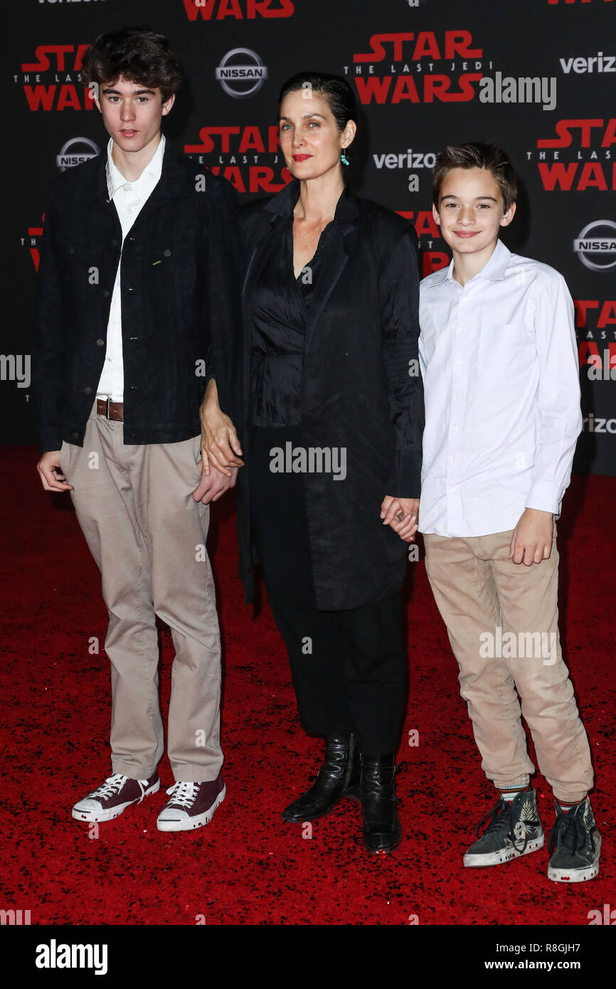 LOS ANGELES, CA, USA - DECEMBER 09: Carrie-Anne Moss, Jaden Roy, Owen Roy at the World Premiere Of Disney Pictures And Lucasfilm's 'Star Wars: The Last Jedi' held at The Shrine Auditorium on December 9, 2017 in Los Angeles, California, United States. (Photo by Xavier Collin/Image Press Agency) Stock Photo