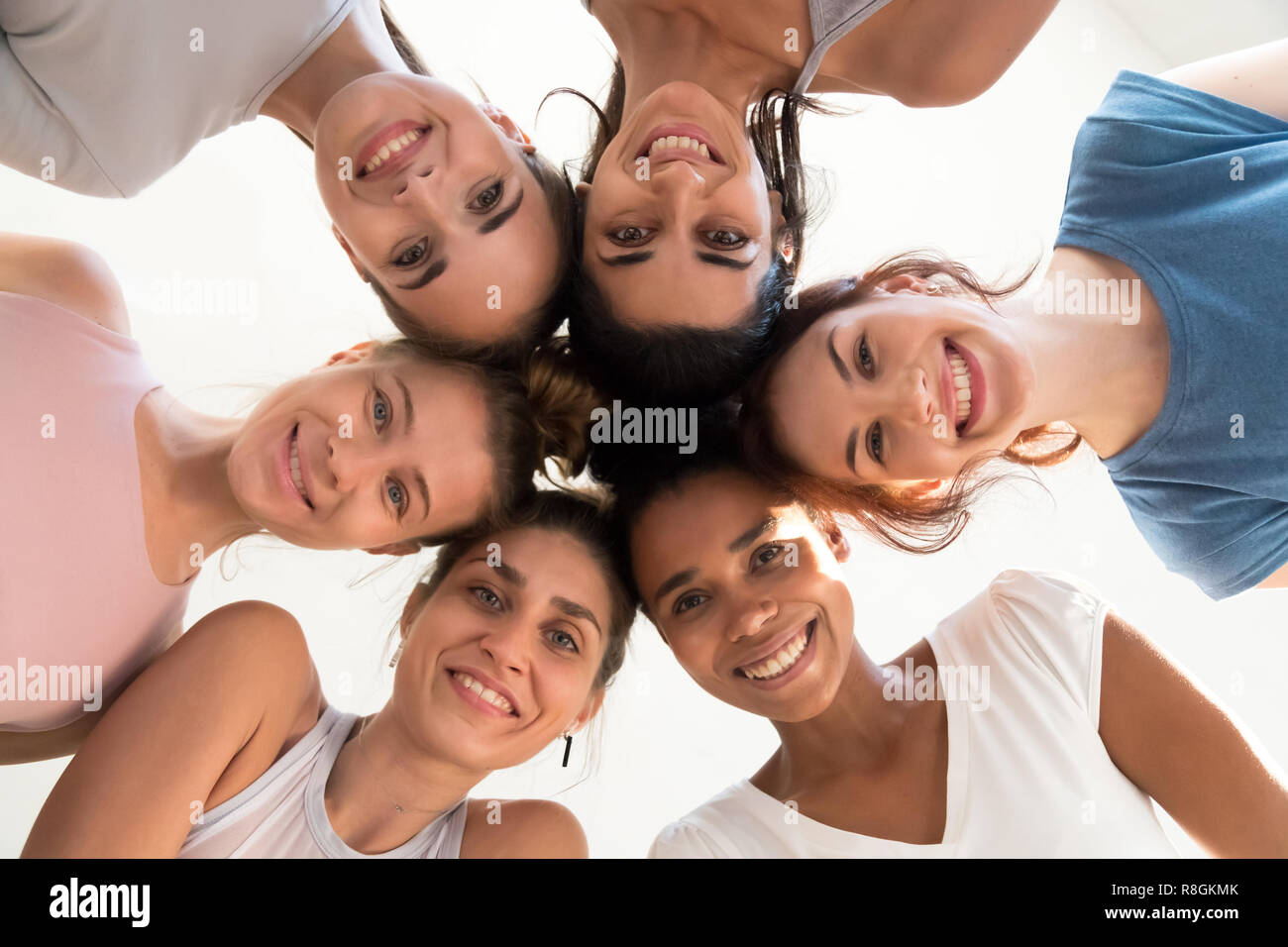 Attractive female standing in circle looking at camera from top Stock Photo