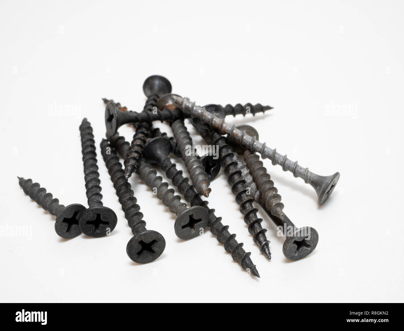 black self tapping screws for wood on white background. diy store