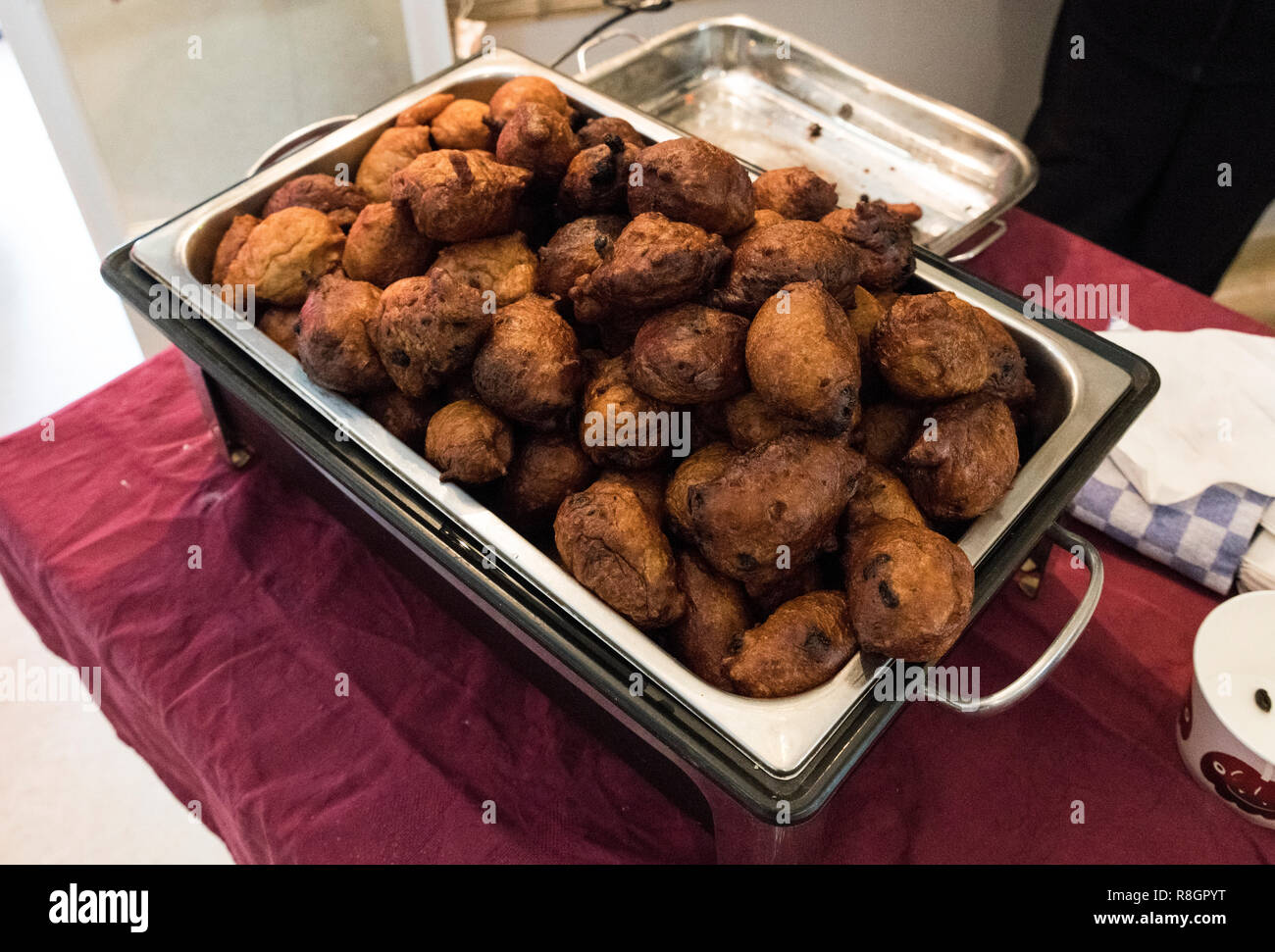 A treat called oliebollen in dutch, which is traditional sweet food for New Year's eve in the Netherlands Stock Photo