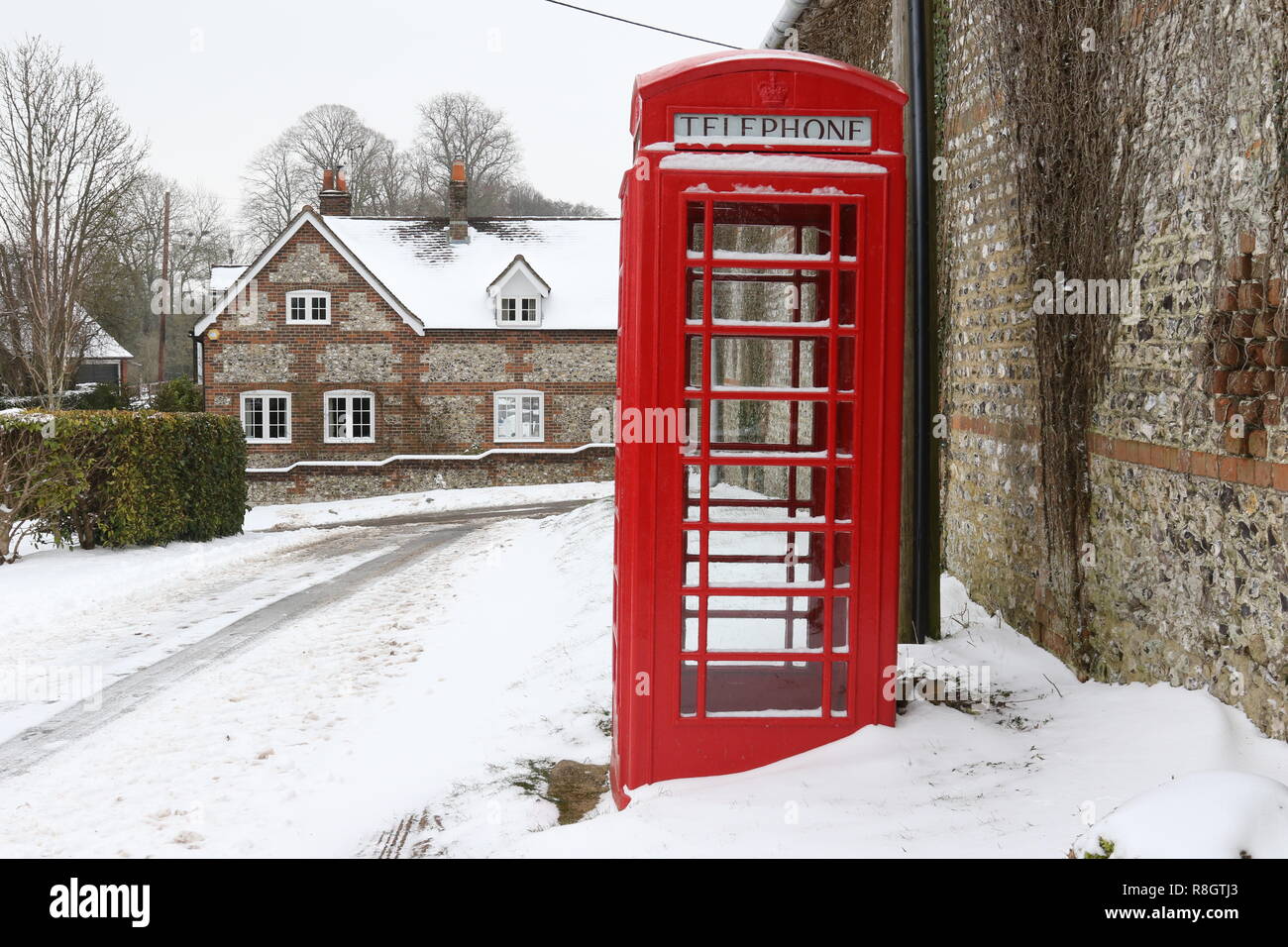 Old phone Box in the snow Stock Photo