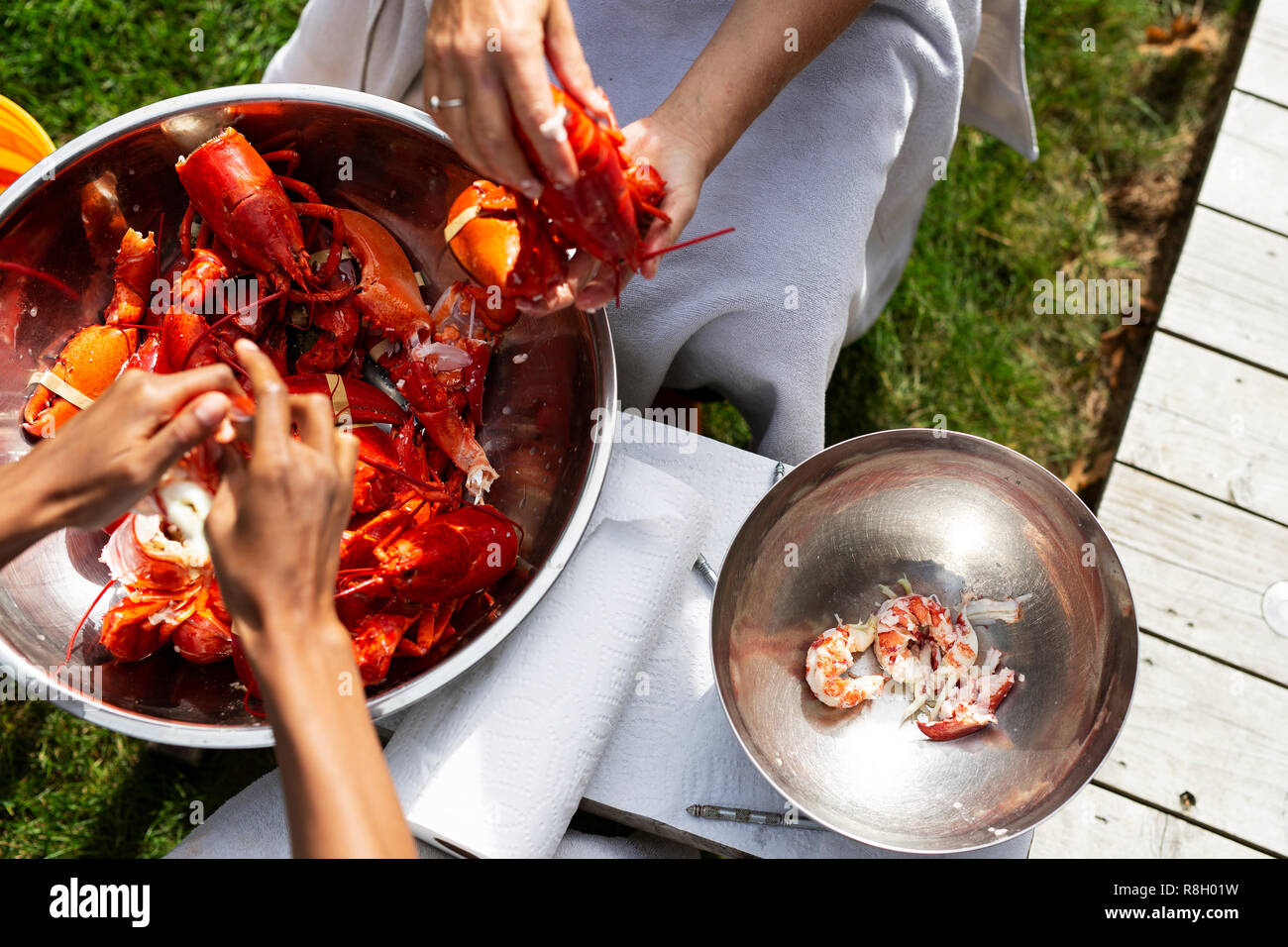Women shucking fresh lobster in Freeport, Maine Stock Photo Alamy