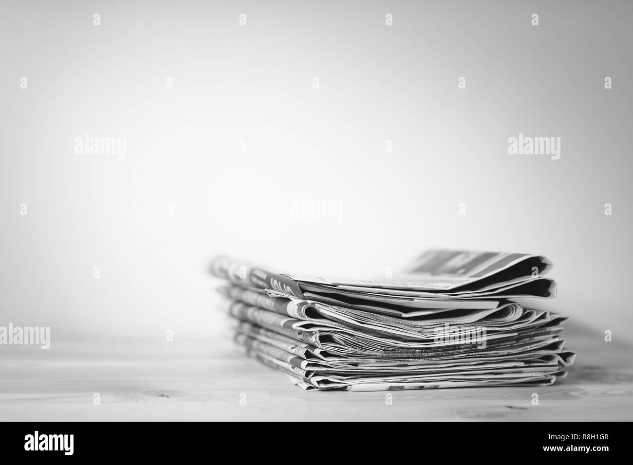 Newspaper on wooden table Stock Photo