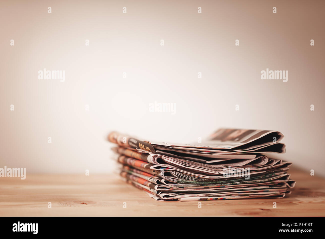 Newspaper on wooden table Stock Photo