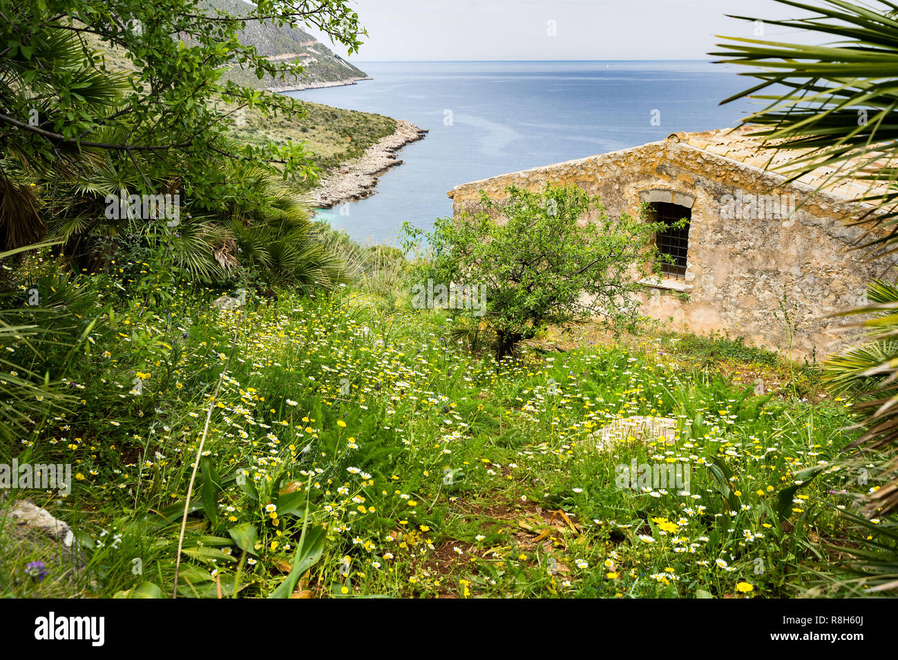 Typical Sicilian house overlooking Mediterranean Sea at Zingaro Nature Reserve, San Vito Lo Capo, Sicily, Italy Stock Photo