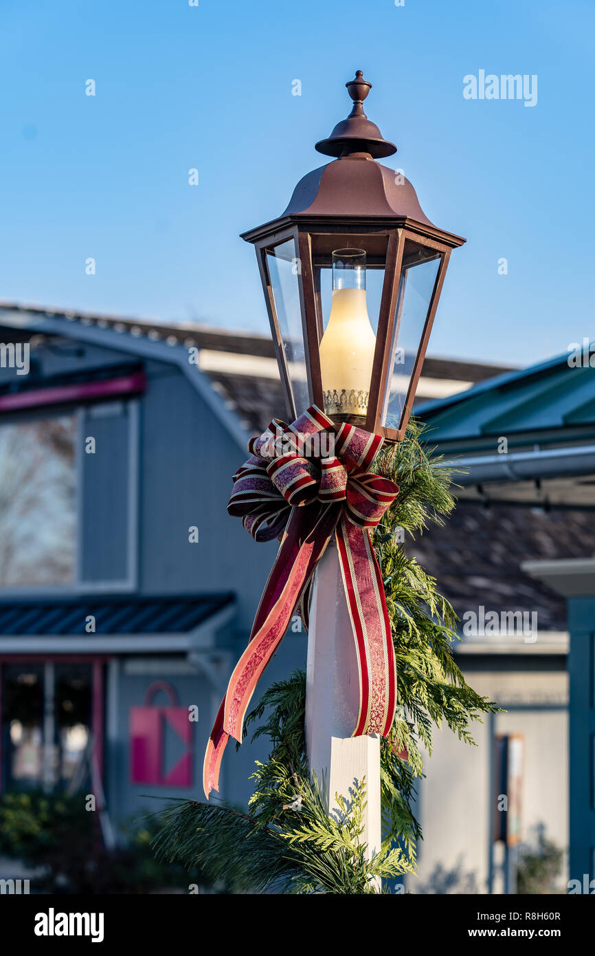 An Electric Street Lamp Decorated For The Christmas Holiday With A