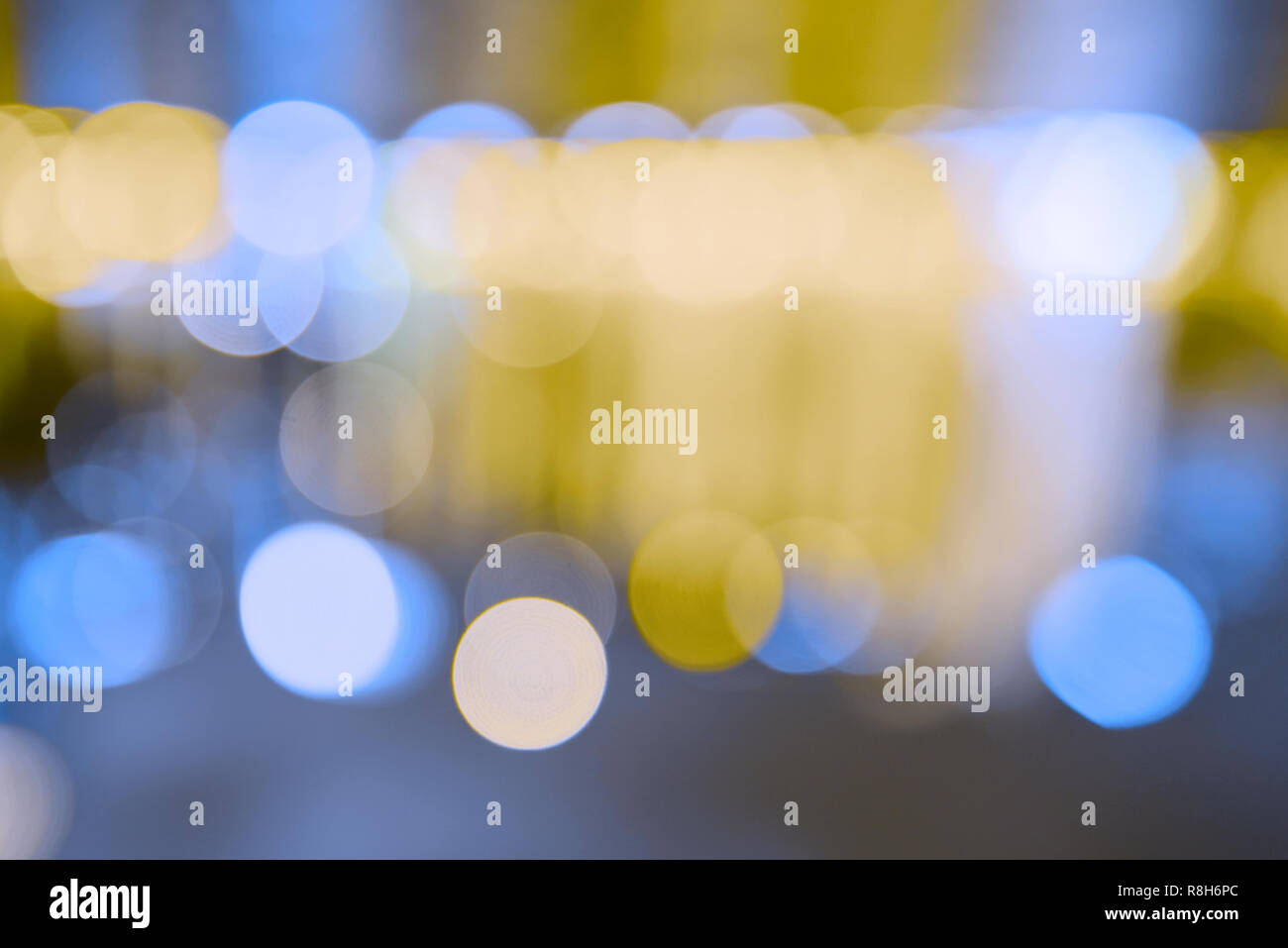 Artistic bokeh background. Defocused circular yellow and blue lights ...