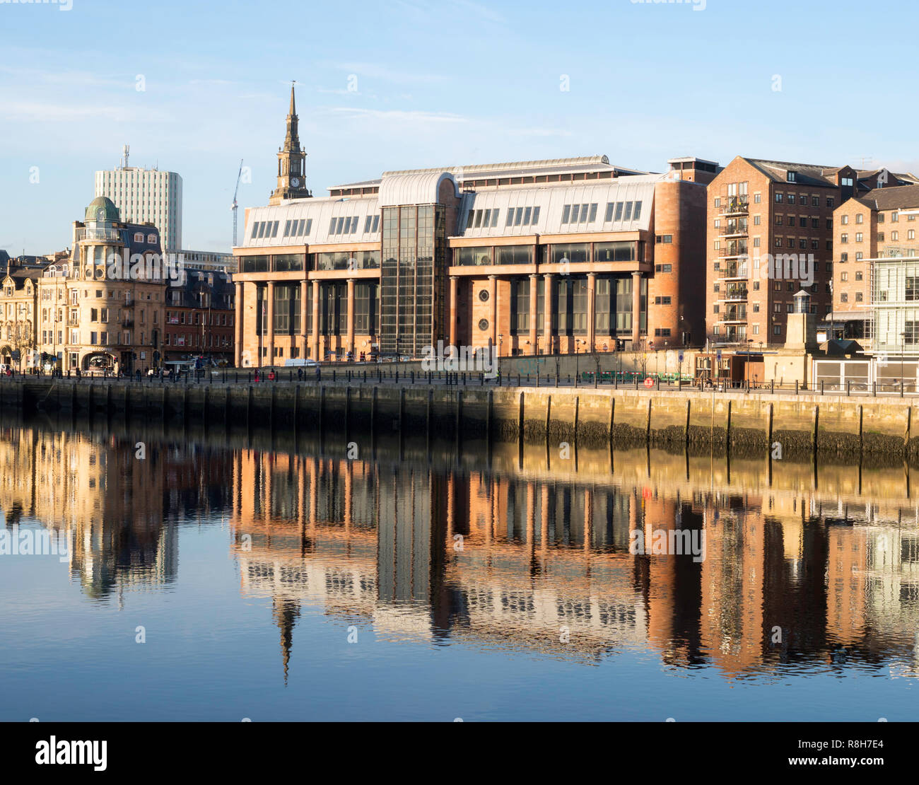 Newcastle crown court building reflected in the river Tyne, north east England, UK Stock Photo