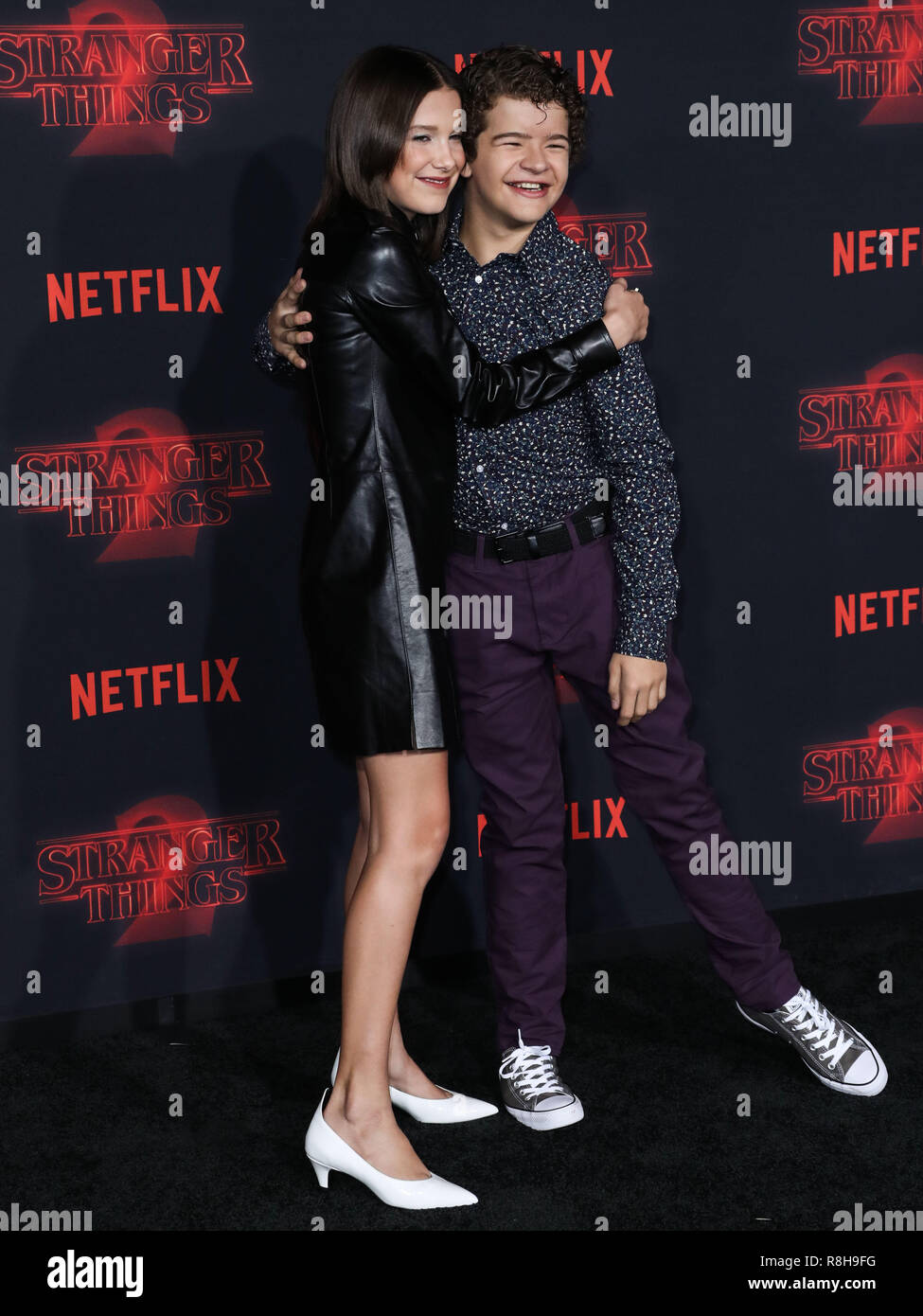 WESTWOOD, LOS ANGELES, CA, USA - OCTOBER 26: Actress Millie Bobby Brown  wearing a Calvin Klein dress arrives at the Los Angeles Premiere Of  Netflix's 'Stranger Things' Season 2 held at the