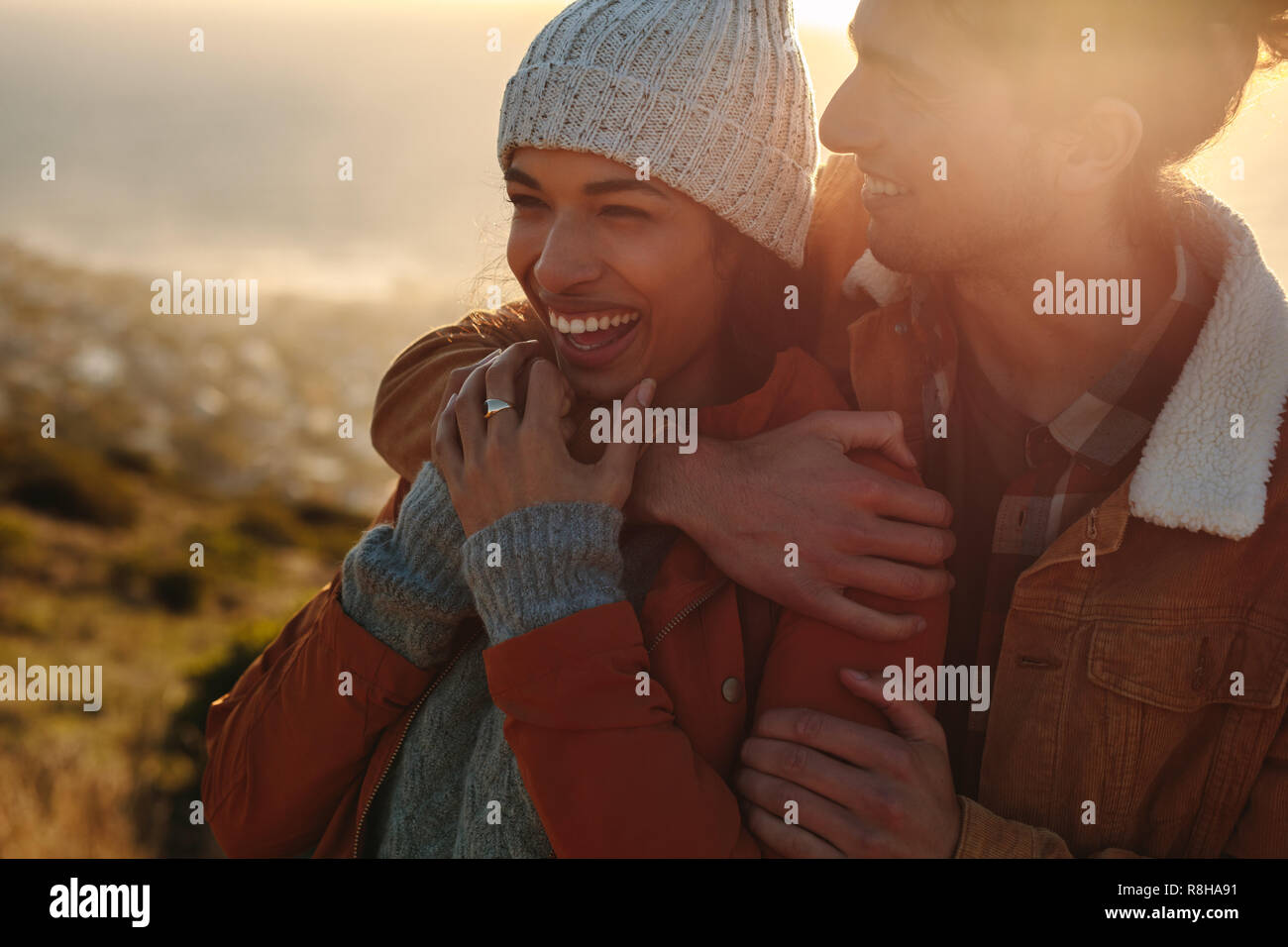 Handsome man hugging beautiful woman hi-res stock photography and ...