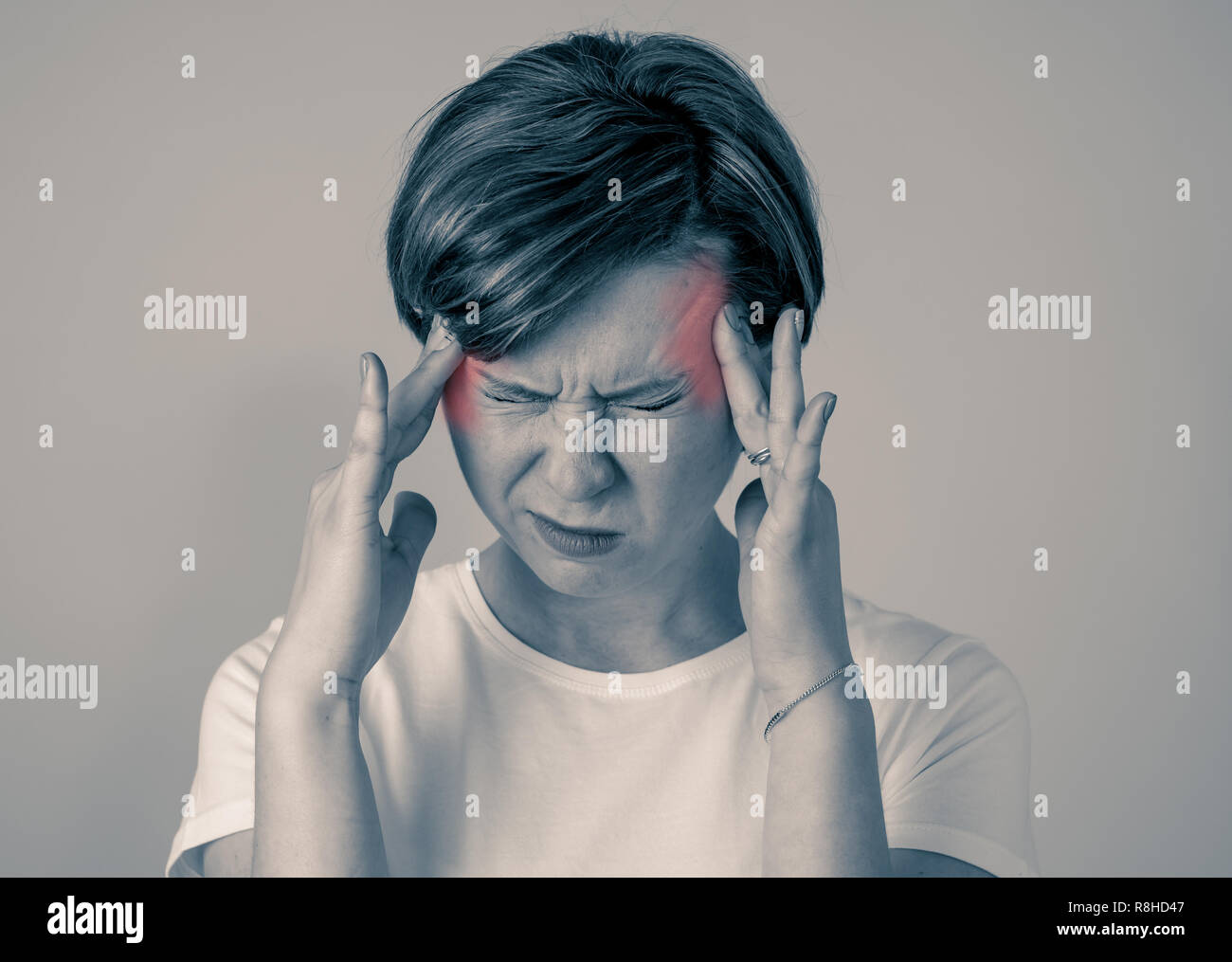 Close up portrait of beautiful young caucasian woman in pain with