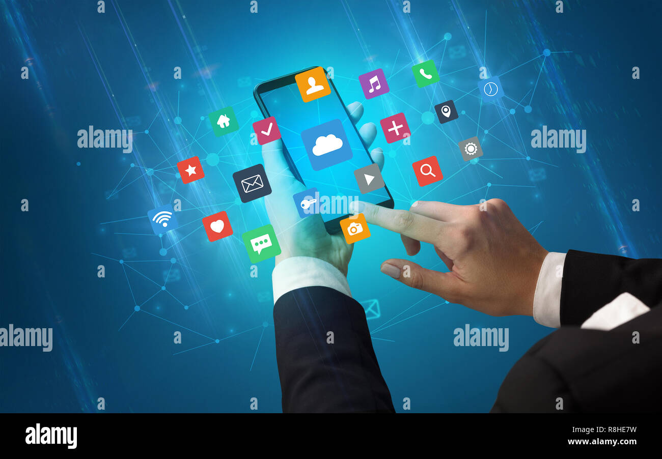 Female hand using smartphone with colorful application icons around ...