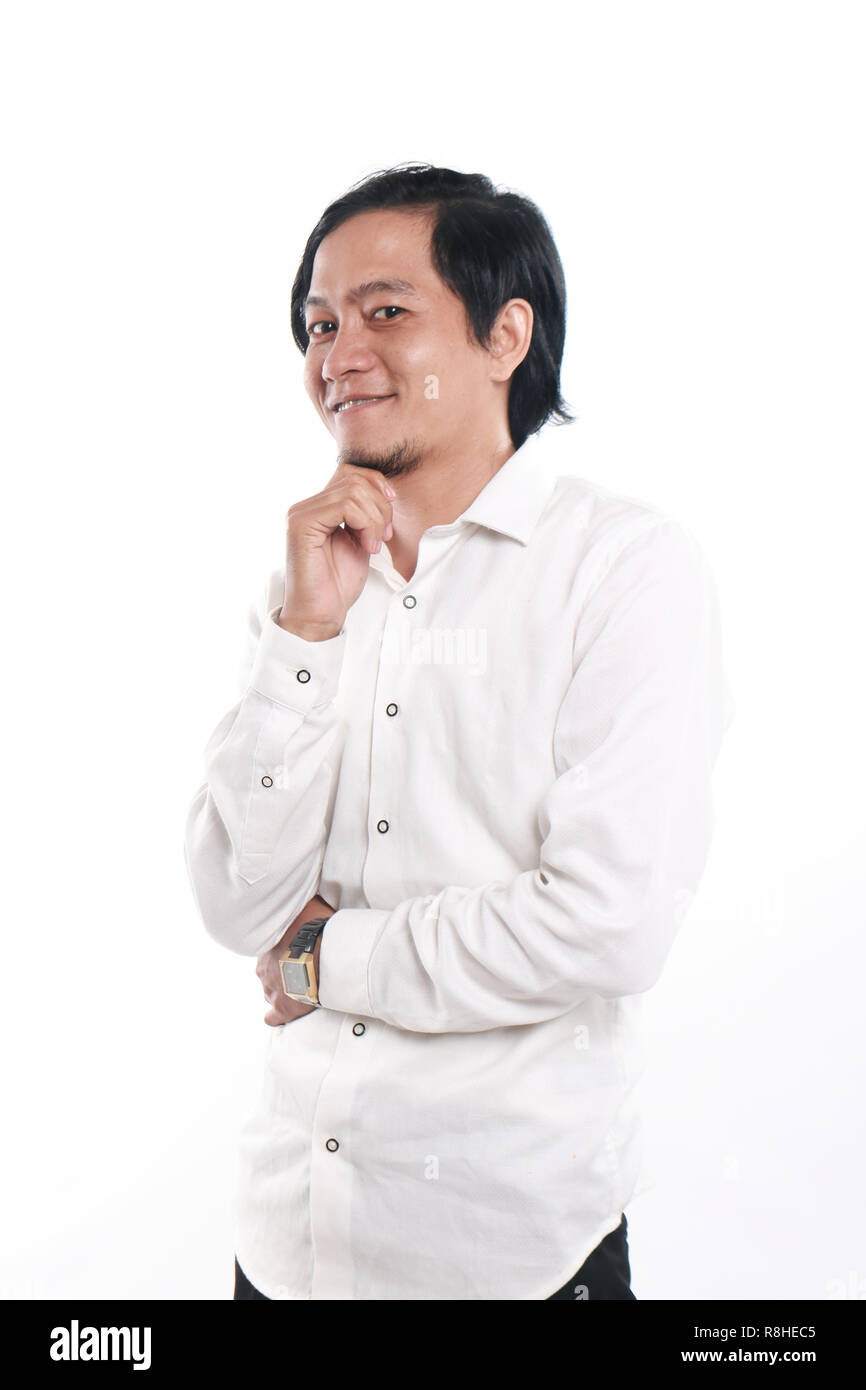Photo image portrait of a funny young successful and confident Asian businessman looked very happy and smiling, half body close up portrait Stock Photo