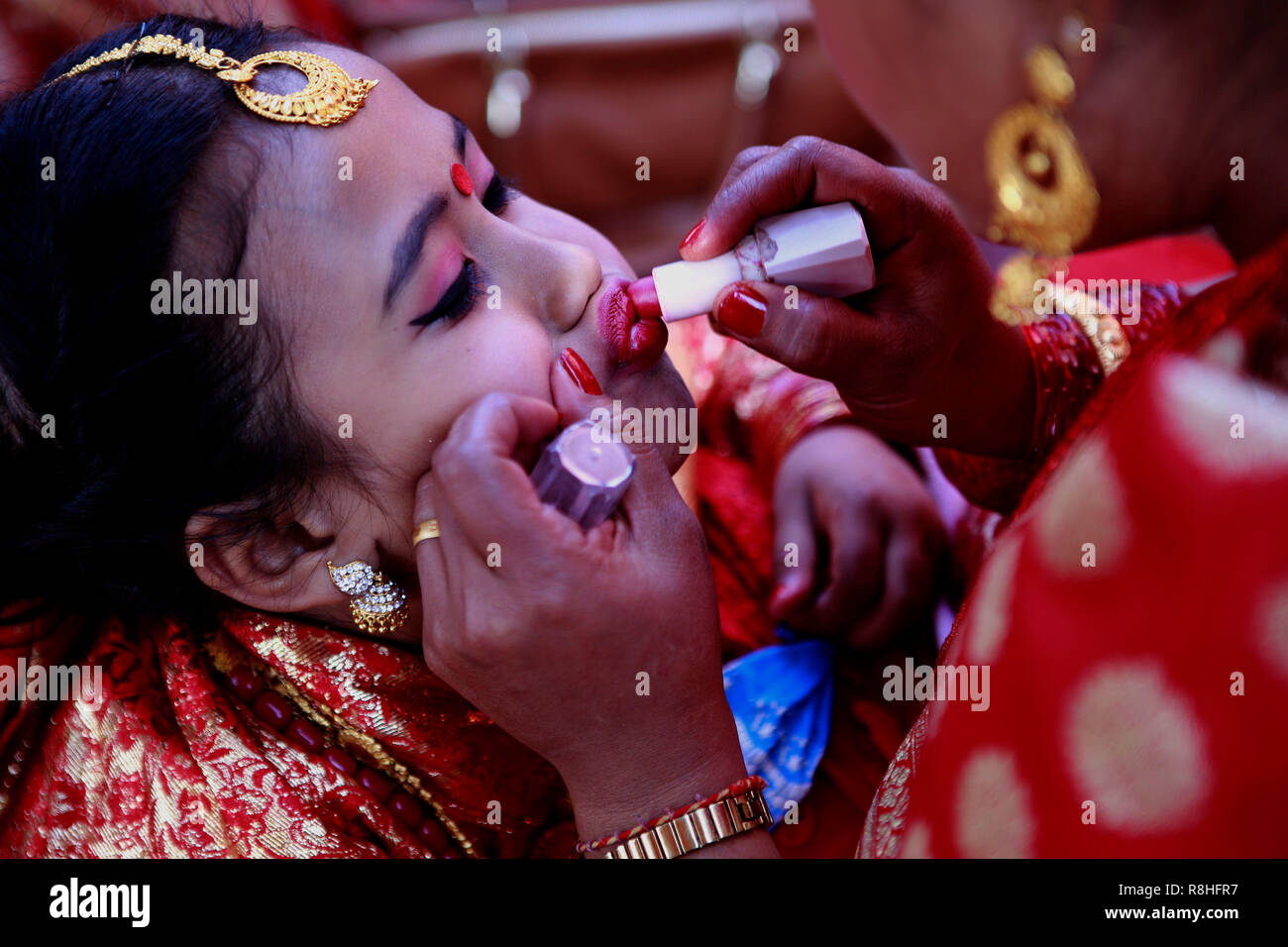 Kathmandu, Nepal, 15th December 2018. A Newar girl in bridal dress is seen being made up for the IHI ceremony IHI also called Bel Bibaha is unique traditional ceremony practiced in Newar communities before puberty. In Newar community girls are married three times in their lives, first is IHI ceremony, which last for two days where girls are married to Lord VISHNU,  Second they are married to the Sun and finally with their real husband. Credit: SOPA Images Limited/Alamy Live News Stock Photo