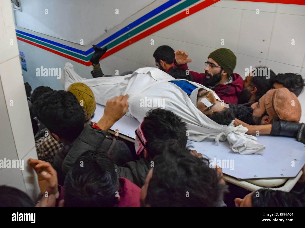 December 15, 2018 - Srinagar, Jammu & Kashmir, India - (EDITORS NOTE: Image depicts death).People seen carrying a dead body of a civilian man after he was declared dead at a hospital in Srinagar.Seven civilians, three armed rebels and an army man were killed during a gun battle between armed rebels and Indian forces at Pulwama in Indian-administered Kashmir. Credit: Idrees Abbas/SOPA Images/ZUMA Wire/Alamy Live News Stock Photo