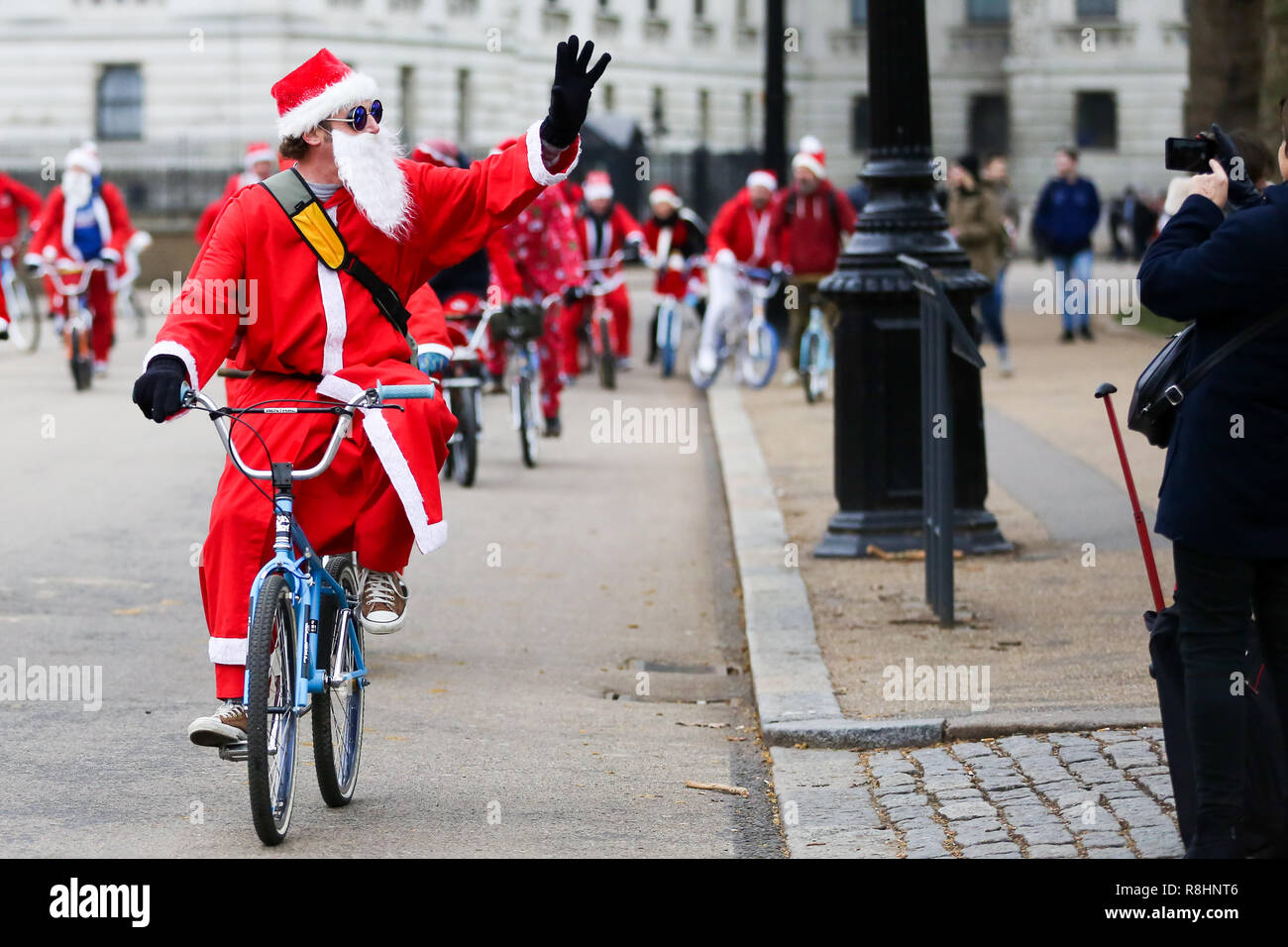 London, UK. 15th Dec, 2018. A man dressed as Father Christmas is seen cycling during the event.Cycling through London to raise awareness and money for Evelina London Children's Hospital (ECHO), for children with heart conditions. The annual event began four years ago after Stephane Wright's son Tommy, suffered a heart attack and spent time at Evelina London. Tommy was only 6 months old when he suffered a heart attack and nearly died. Fortunately Tommy recovered well but will require further operations as he grows up, so will be returning to the Evelina London in time. (Cred Stock Photo