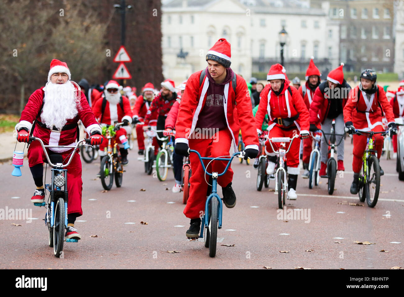 London, UK. 15th Dec, 2018. People dressed as Father Christmas are seen before cycling during the event.Cycling through London to raise awareness and money for Evelina London Children's Hospital (ECHO), for children with heart conditions. The annual event began four years ago after Stephane Wright's son Tommy, suffered a heart attack and spent time at Evelina London. Tommy was only 6 months old when he suffered a heart attack and nearly died. Fortunately Tommy recovered well but will require further operations as he grows up, so will be returning to the Evelina London in ti Stock Photo