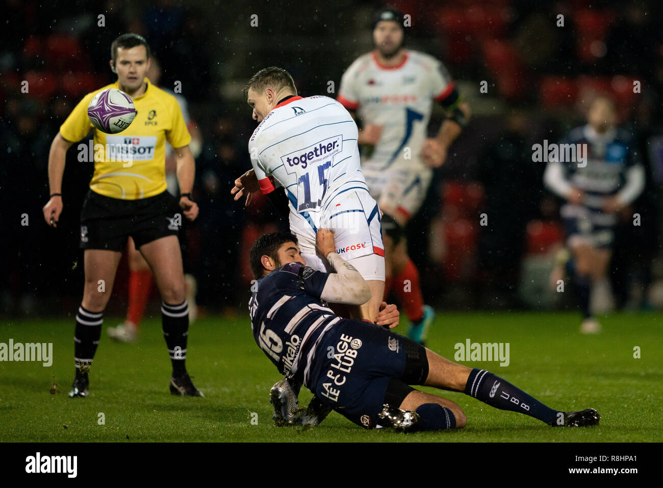 Salford, Manchester, UK. 15th Dec 2018. Sale Shark's Chris Ashton is tackled by  Bordeaux Belges's Roamian Buros   15th December 2018, AJ Bell Stadium , Sale, England; European Rugby Challenge Cup, Sale v Bordeaux-Belges ;   Credit: Terry Donnelly / News Images Credit: News Images /Alamy Live News Stock Photo
