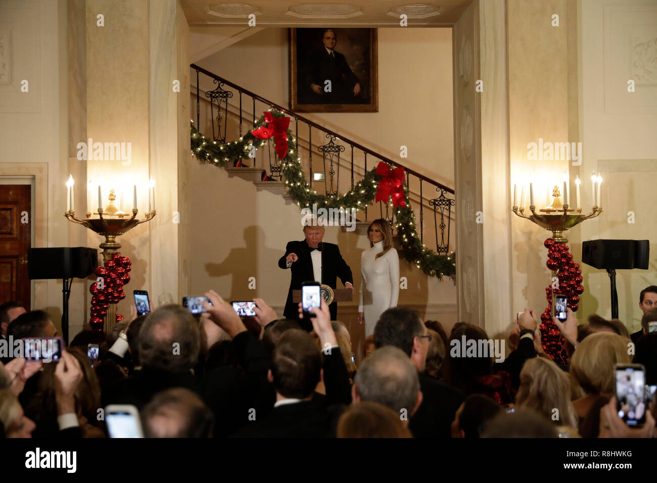 United States President Donald J. Trump makes remarks as First lady Melania Trump looks on at the Congressional Ball at White House in Washington, DC on December 15, 2018. Credit: Yuri Gripas/Pool via CNP/MediaPunch Stock Photo