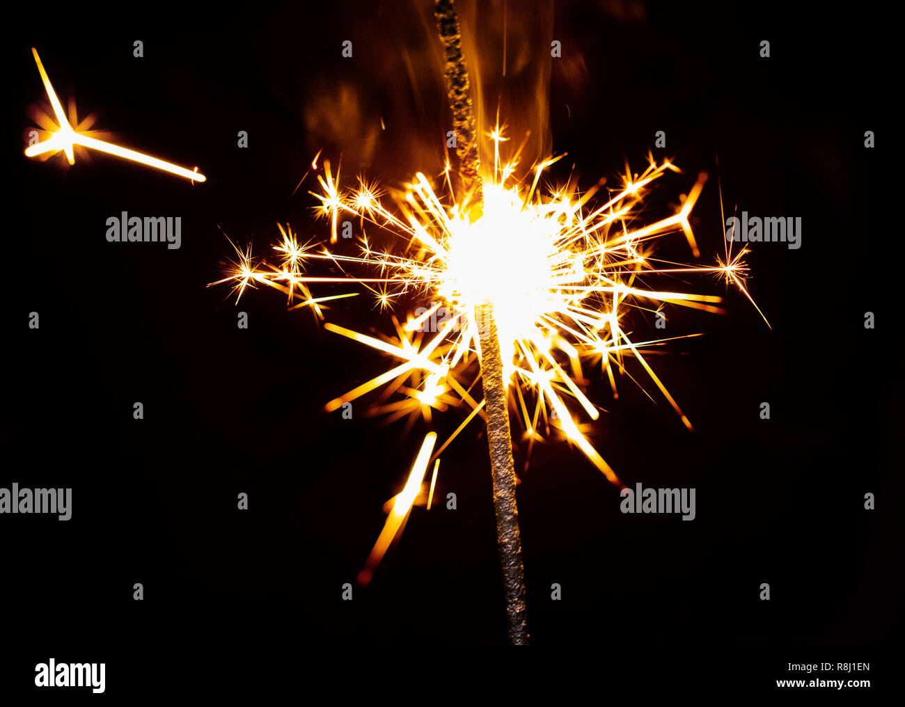 burning sparkler close-up on a black background Stock Photo