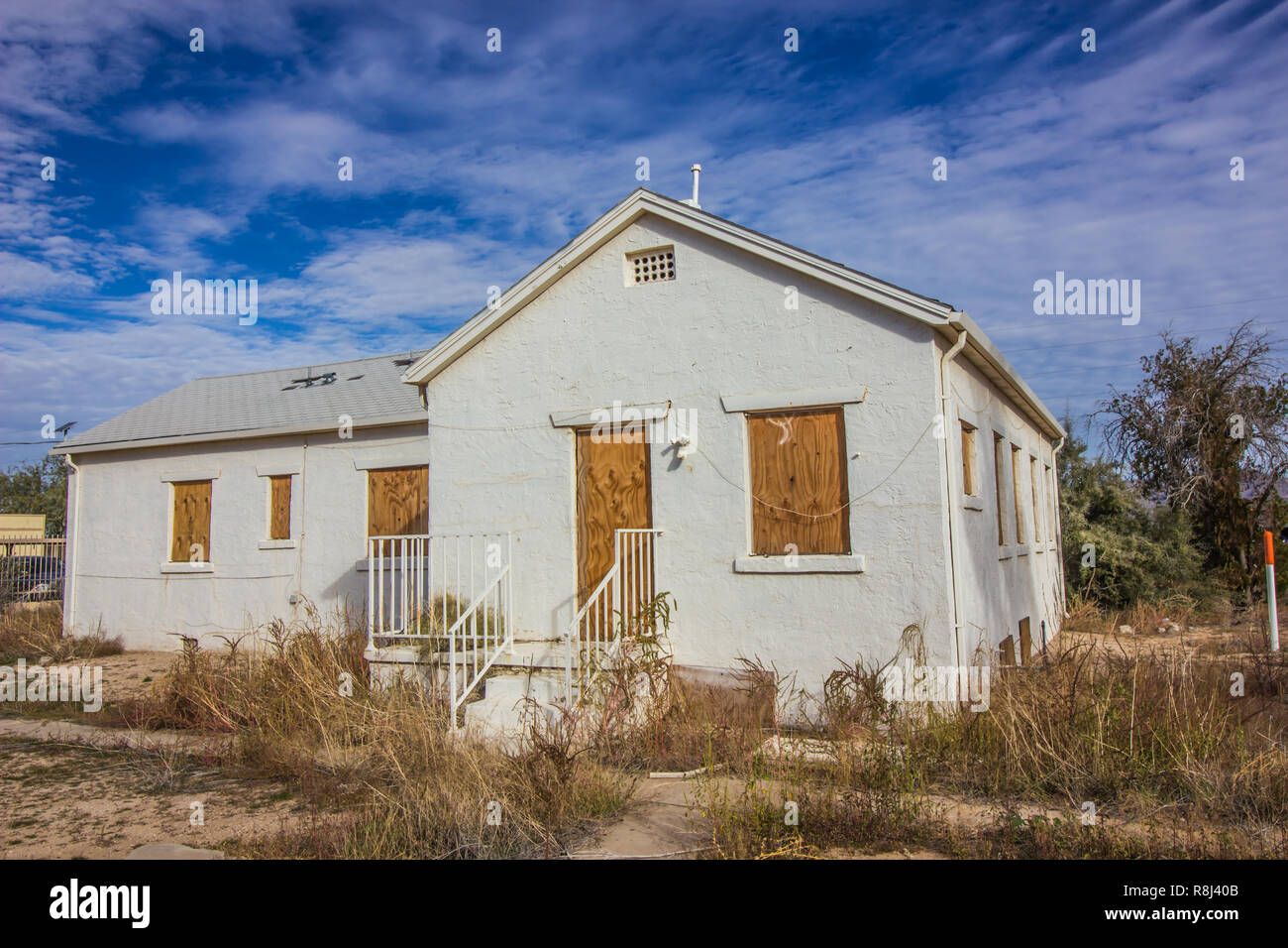 Old House With Boarded Up Windows & Door Stock Photo