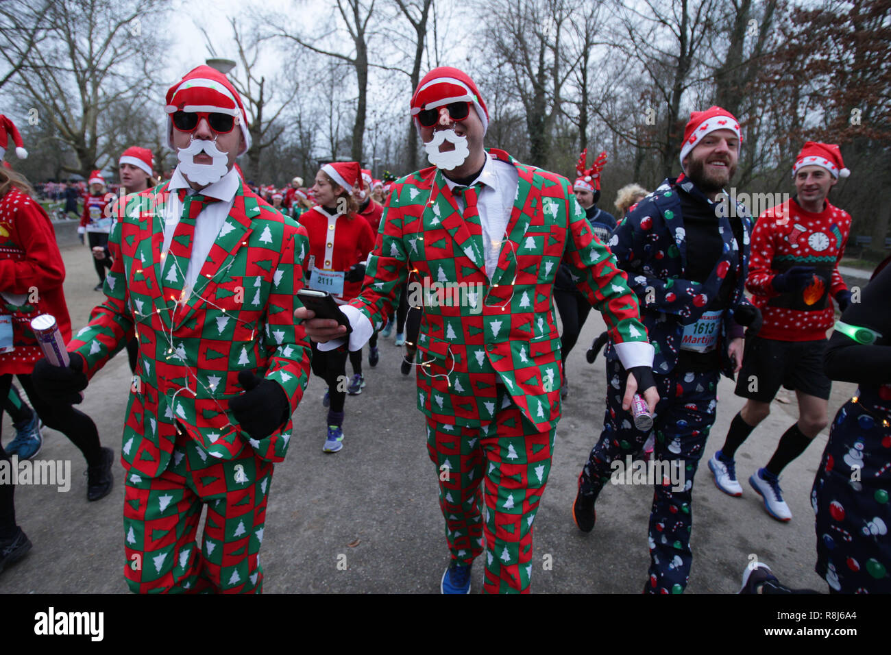 People take part during Ugly Christmas Sweater run at the Vondelpark on  December 15, 2018 in Amsterdam,Netherlands. Participants run 5 kilometers  thro Stock Photo - Alamy