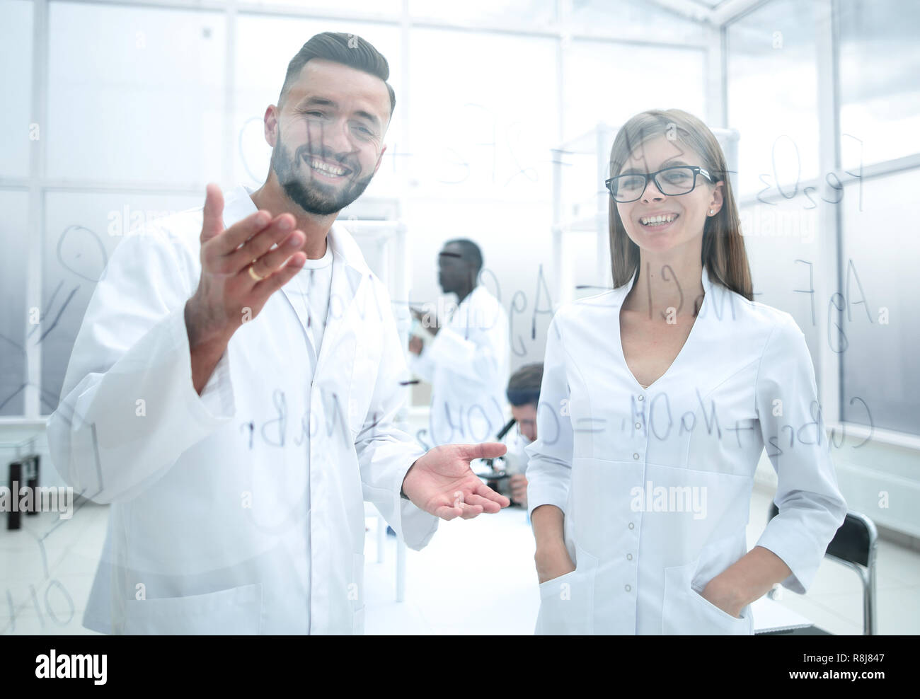 man and woman in white lab coats Stock Photo - Alamy