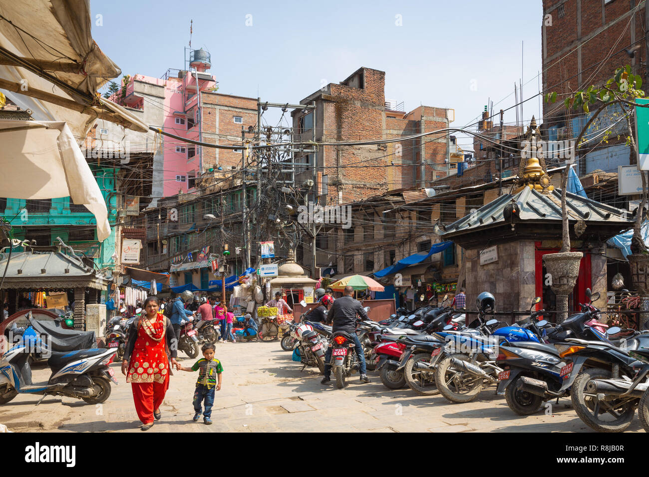 People walking through urban shopping area in Kathmandu, Nepal Stock Photo